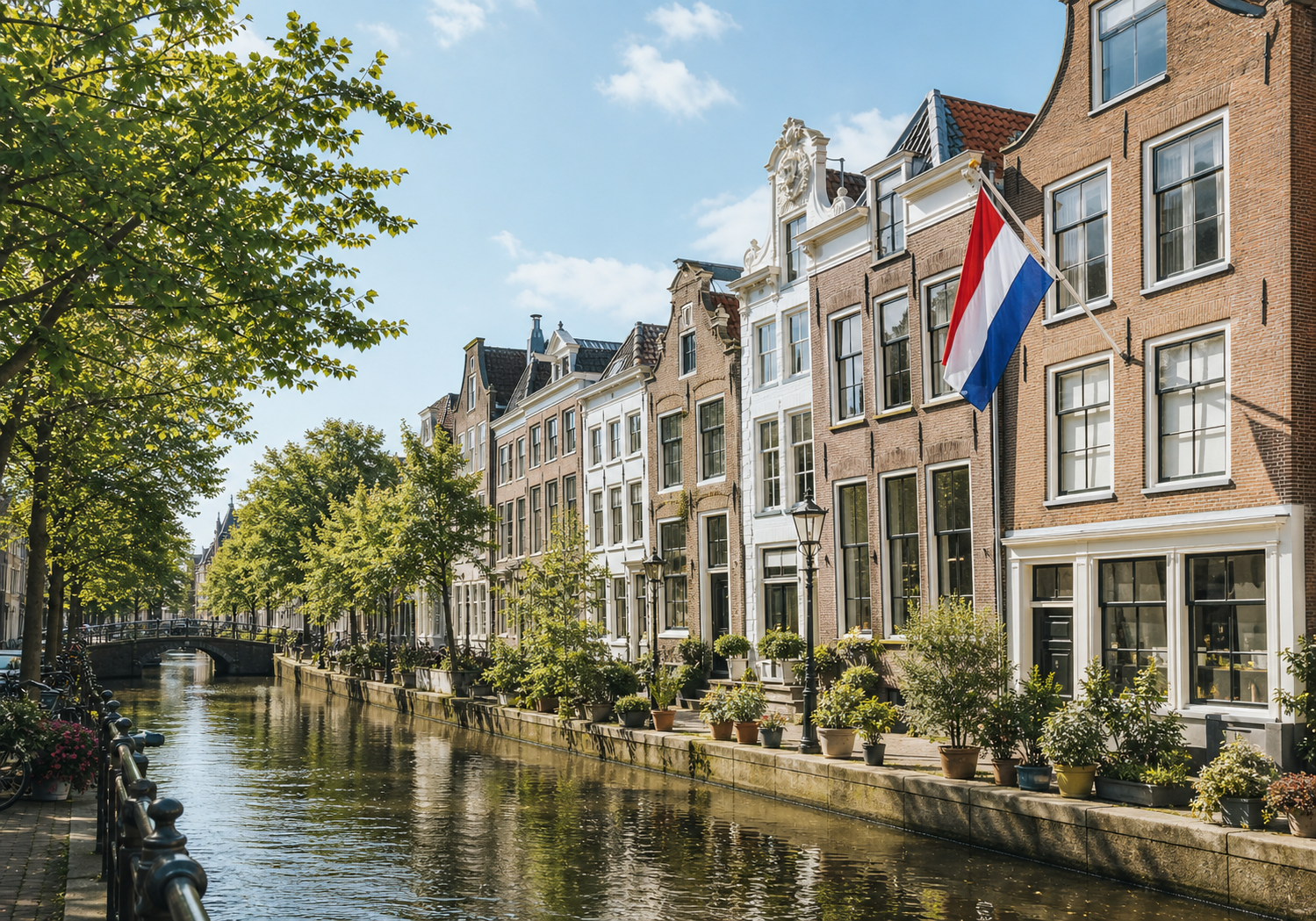 Dutch canal houses with a Netherlands flag in a historic city street